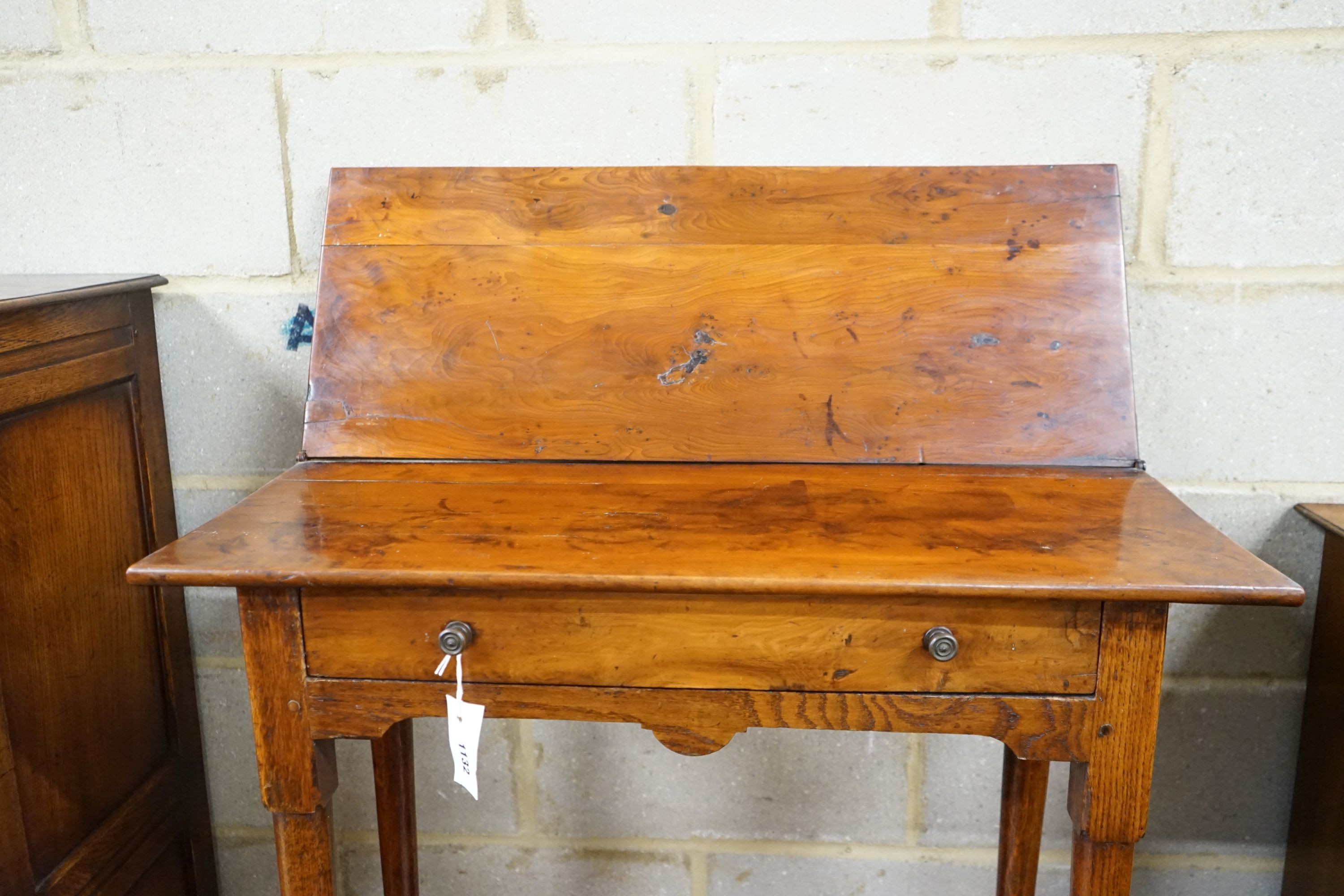 An 18th century provincial yew and oak rectangular folding tea table, width 80cm, depth 31cm, height 72cm